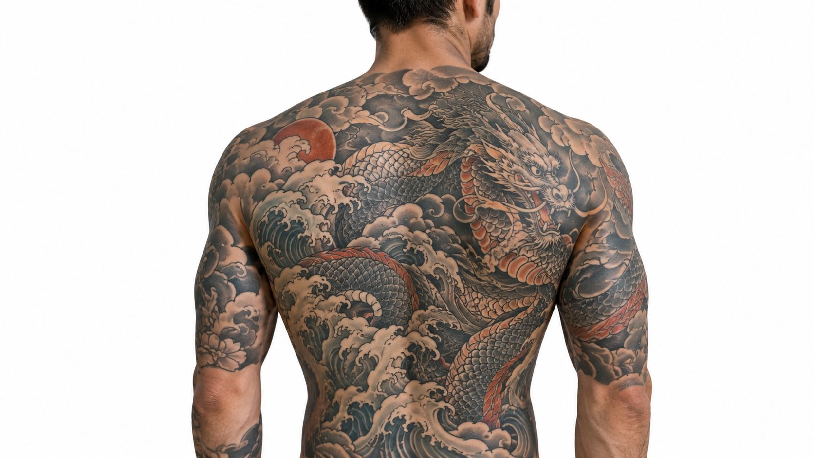 A man showing an intricate, full-back Japanese dragon and waves tattoo design against a white background.